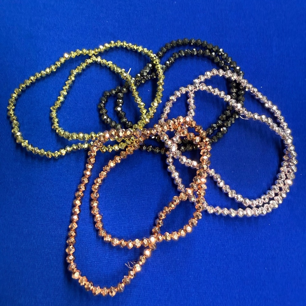 Bundle of Pink, Black, Gold, and Light Pink Hematite Bead Strands.